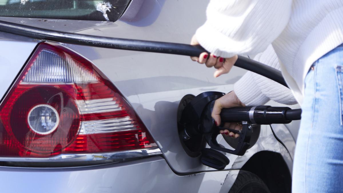 A woman fills up her car at a self-service gas station following the abolition of the €0.20 bonus by the Spanish government on January 3, 2023 in Seville (Andalusia, Spain). Since the beginning of the new year, 2023, the Spanish government has abolished the €0.20 bonus per liter of fuel to relieve drivers' pockets.
