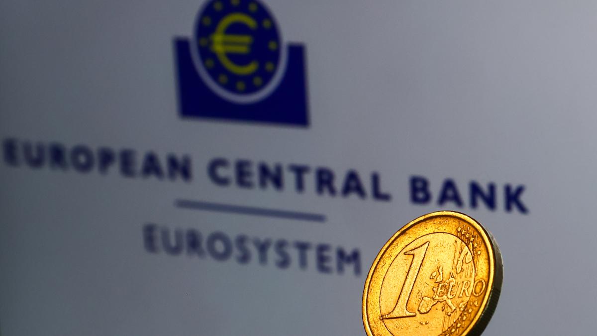 european central bank eurosystem sign with a euro coin in the forefront