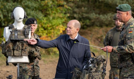German Chancellor Olaf Scholz looks at personal equipment of soldiers during his visite of the Bundeswehr army training center in Ostenholz on October 17, 2022 near Hodenhagen, Germany. Scholz has vowed to modernize Germany's armed forces with a special EUR 100 billion budget following Russia's military invasion of Ukraine. 