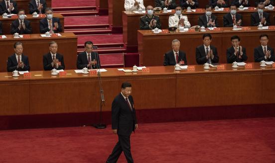 Chinese President Xi Jinping, right, is applauded by senior members of the government as he walks on stage before his speech to the Opening Ceremony of the 20th National Congress of the Communist Party of China at The Great Hall of People on October 16, 2022 in Beijing, China. Xi Jinping is widely expected to secure a third term in power. 