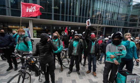 Striking Deliveroo riders protest outside Goldman Sachs on April 6, 2021 in London, England. Deliveroo riders strike for better pay, better rights and better safety.