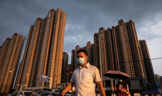  A man wears a mask while walking through the Evergrande changqing community on September 24, 2021 in Wuhan, Hubei Province, China
