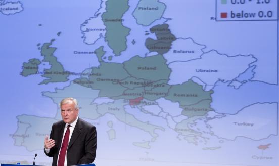 Man speaking in front of a map of Europe.