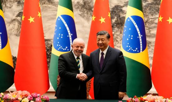Brazilian President Luiz Inacio Lula da Silva (L) shakes hands with Chinese President Xi Jinping