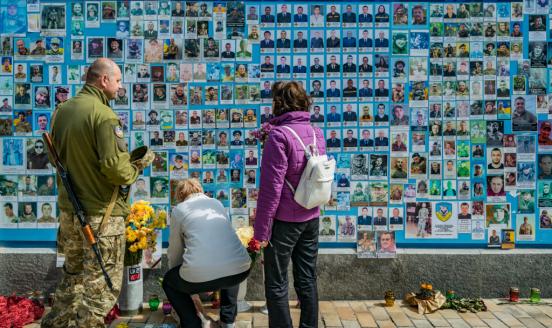 a memorial wall with photos of soldiers who died in rus-Ukraine war