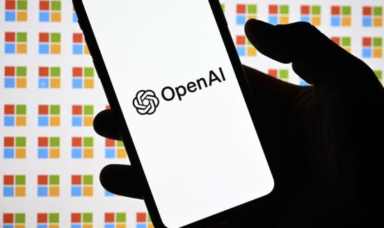 OpenAI logo is displayed on a mobile phone screen