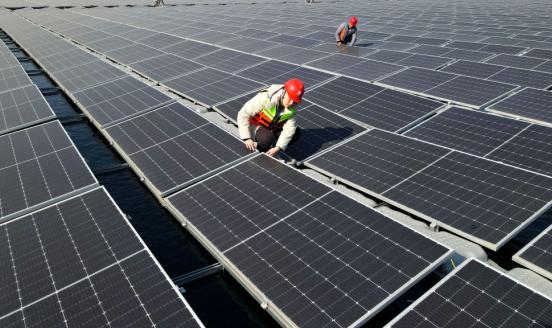 A man working on sun panels