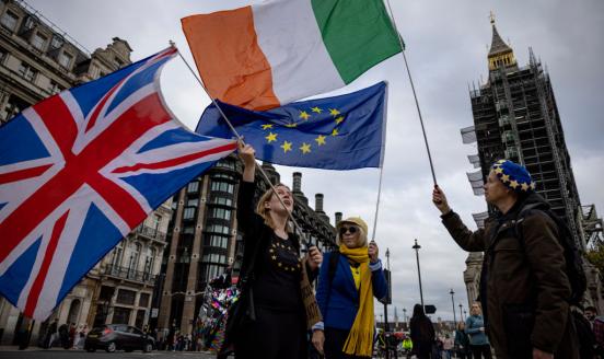 LONDON, ENGLAND - OCTOBER 13: Anti-Brexit protesters wave the flags of the United Kingdom, Ireland and European Union outside Parliament on October 13, 2021 in London, England. (Photo by Rob Pinney/Getty Images)