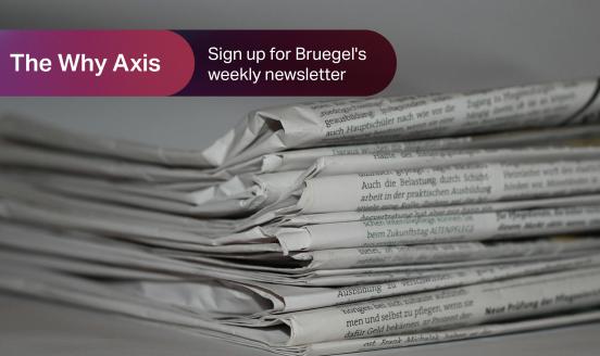 stack of newspapers with a ribbon with text 'The Why Axis'
