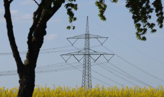 An electricity pylon stands on May 02, 2024 near Altentreptow, Germany. Germany is investing in the expansion of its electric grid as it increases renewable energies production capacity. On any given day Germany produces between 30% and 65% of its electricity from wind and solar. The German government has set 2038 as the cutoff for shuttering its remaining coal-fired energy production. (Photo by Sean Gallup/Getty Images)